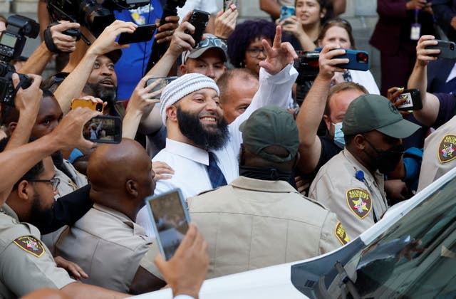 <p>Adnan Syed walks out of Baltimore court a free man after his conviction was overturned </p>