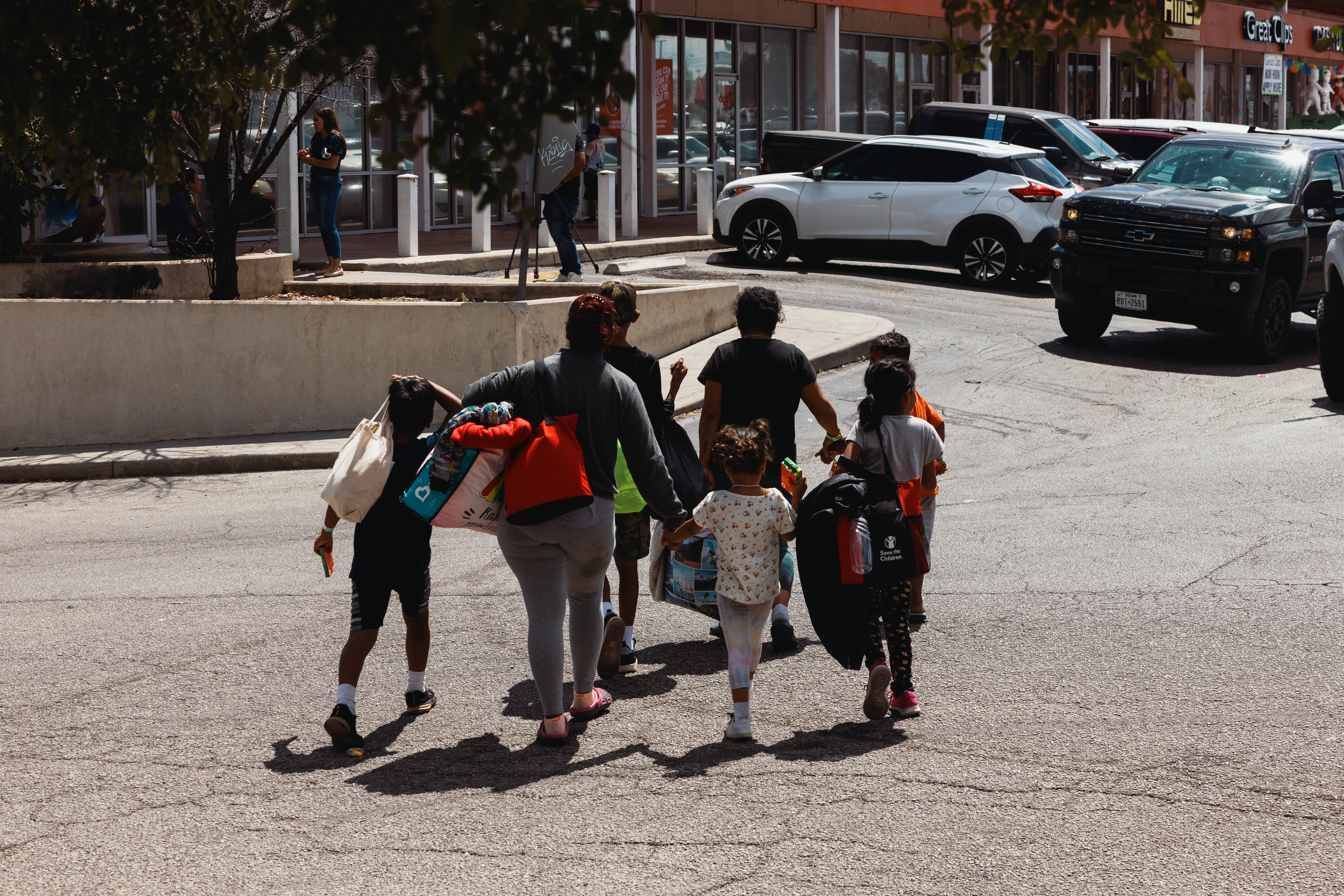 A family leaves the Migrant Resource Center in San Antonio, Texas on 19 September.