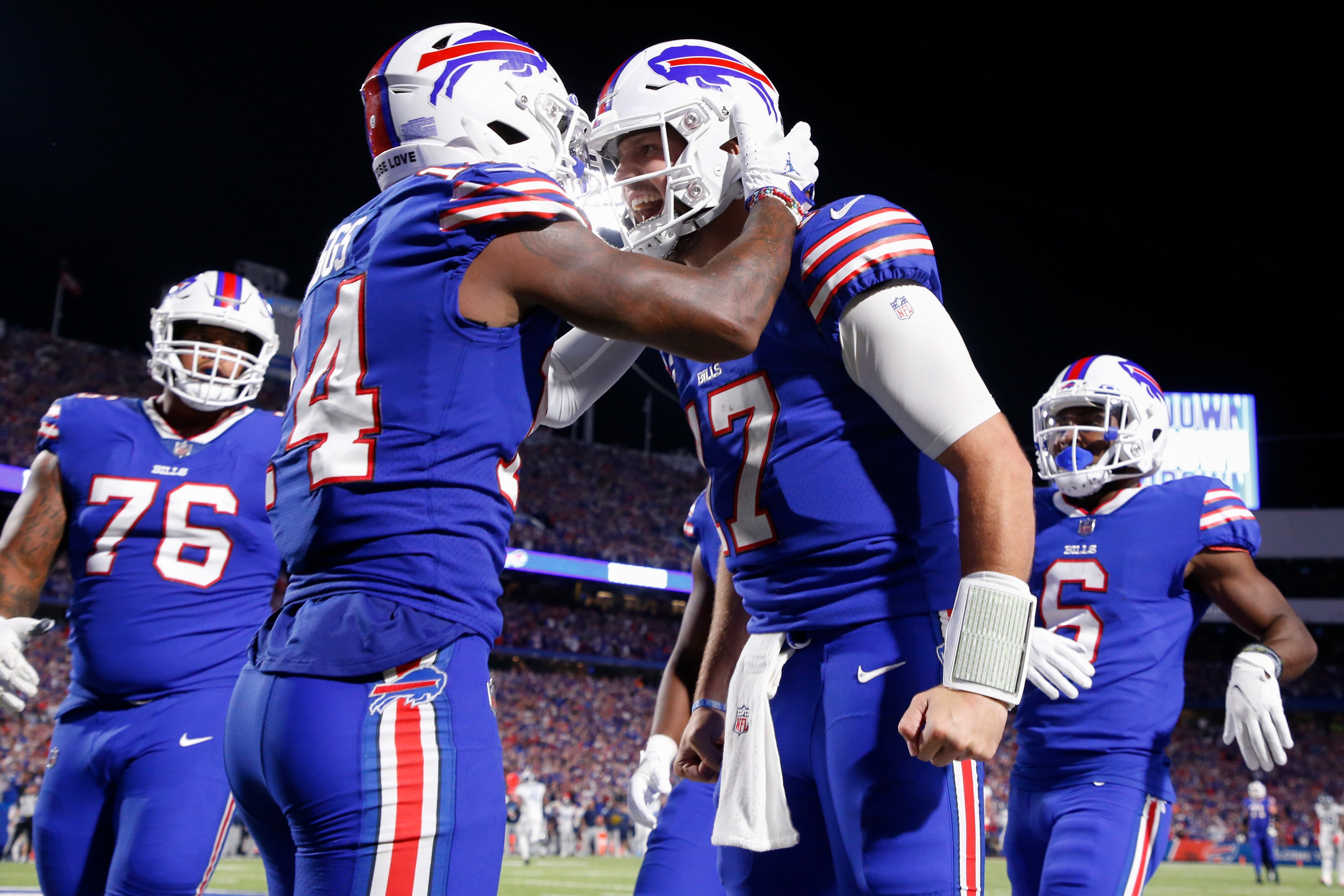 Buffalo Bills’ Stefon Diggs, second from left, celebrates with quarterback Josh Allen, second from right, after they connected for a touchdown during the second half of an NFL football game against the Tennessee Titans (Jeffrey T Barnes/PA)