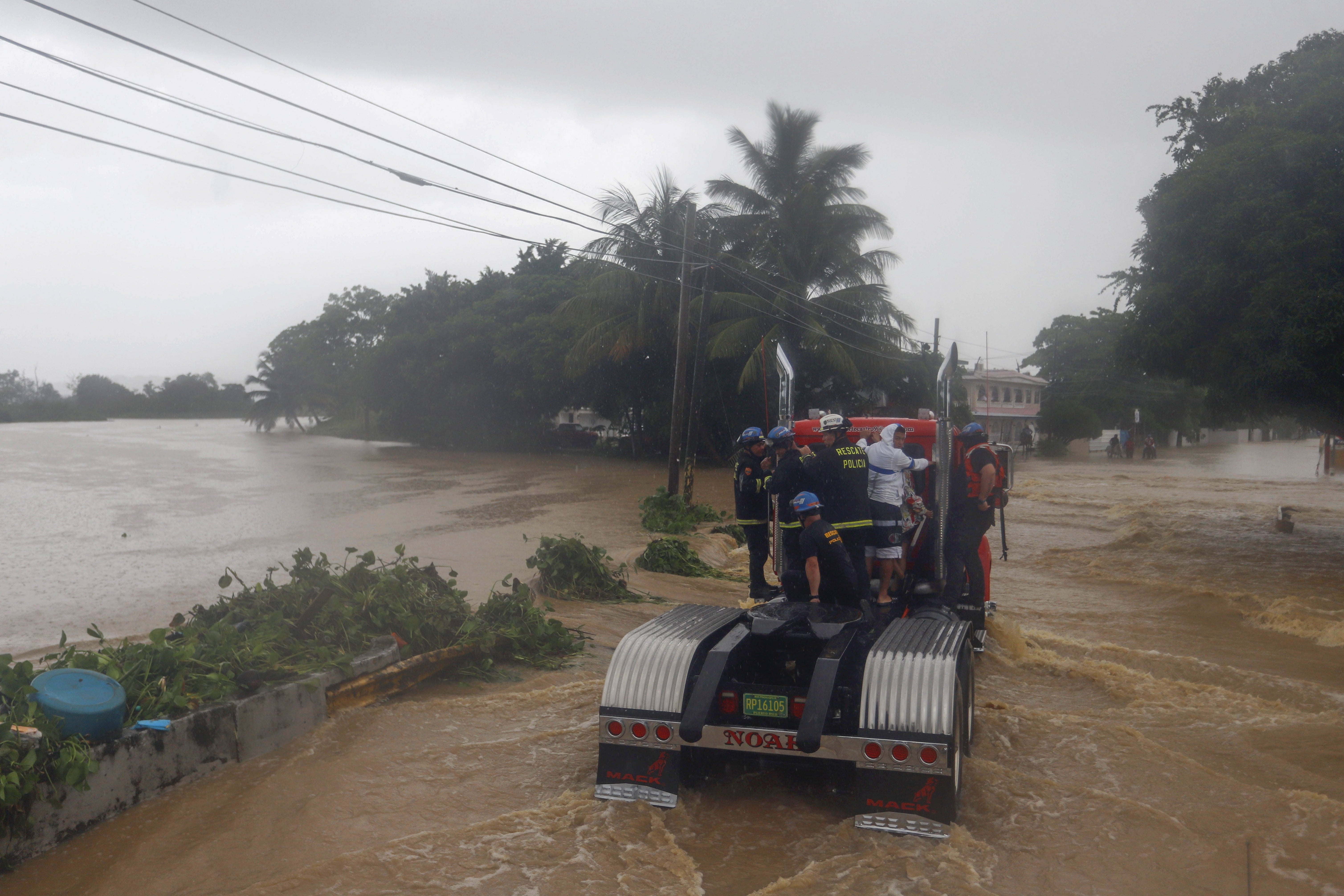 Members of the Rescue Police drive in a flooded street after the passage of hurricane Fiona, in Toa Baja, Puerto Rico, 19 September 2022.