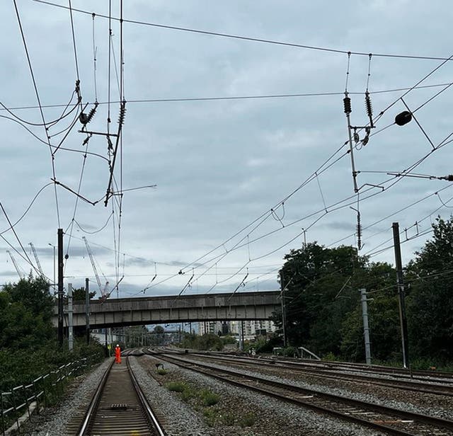 Disruption to train services which caused thousands of mourners to miss the Queen’s funeral will continue until noon on Tuesday, passengers were warned (Network Rail/PA)