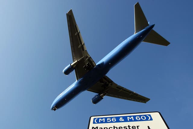 <p> A passenger aircraft landing at Manchester International Airport (stock image) </p>
