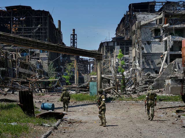 <p>Russian soldiers patrol an area of Kremlin-controlled Mariupol.  </p>