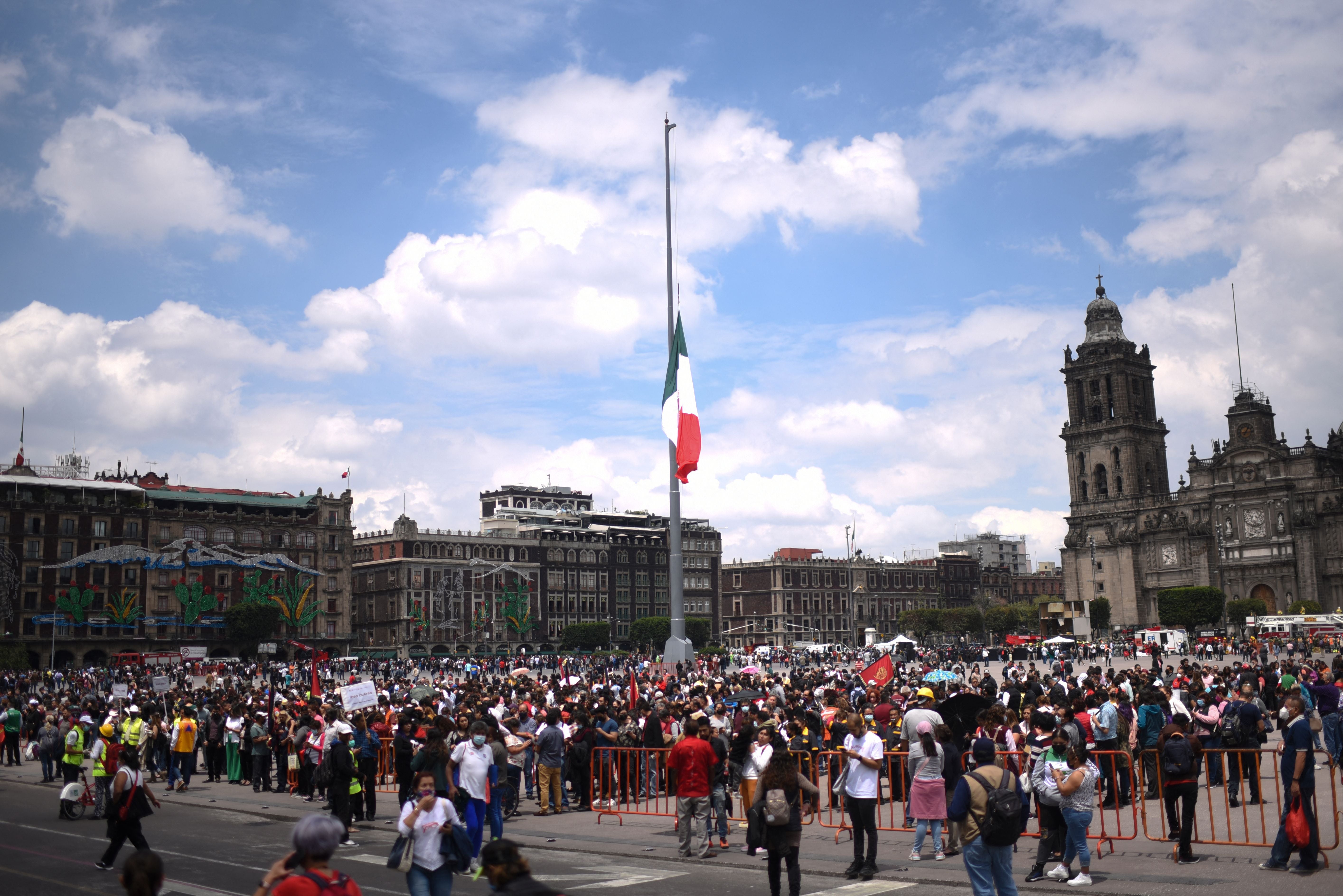 People remain at Zocalo square after an earthquake in Mexico City on September 19, 2022