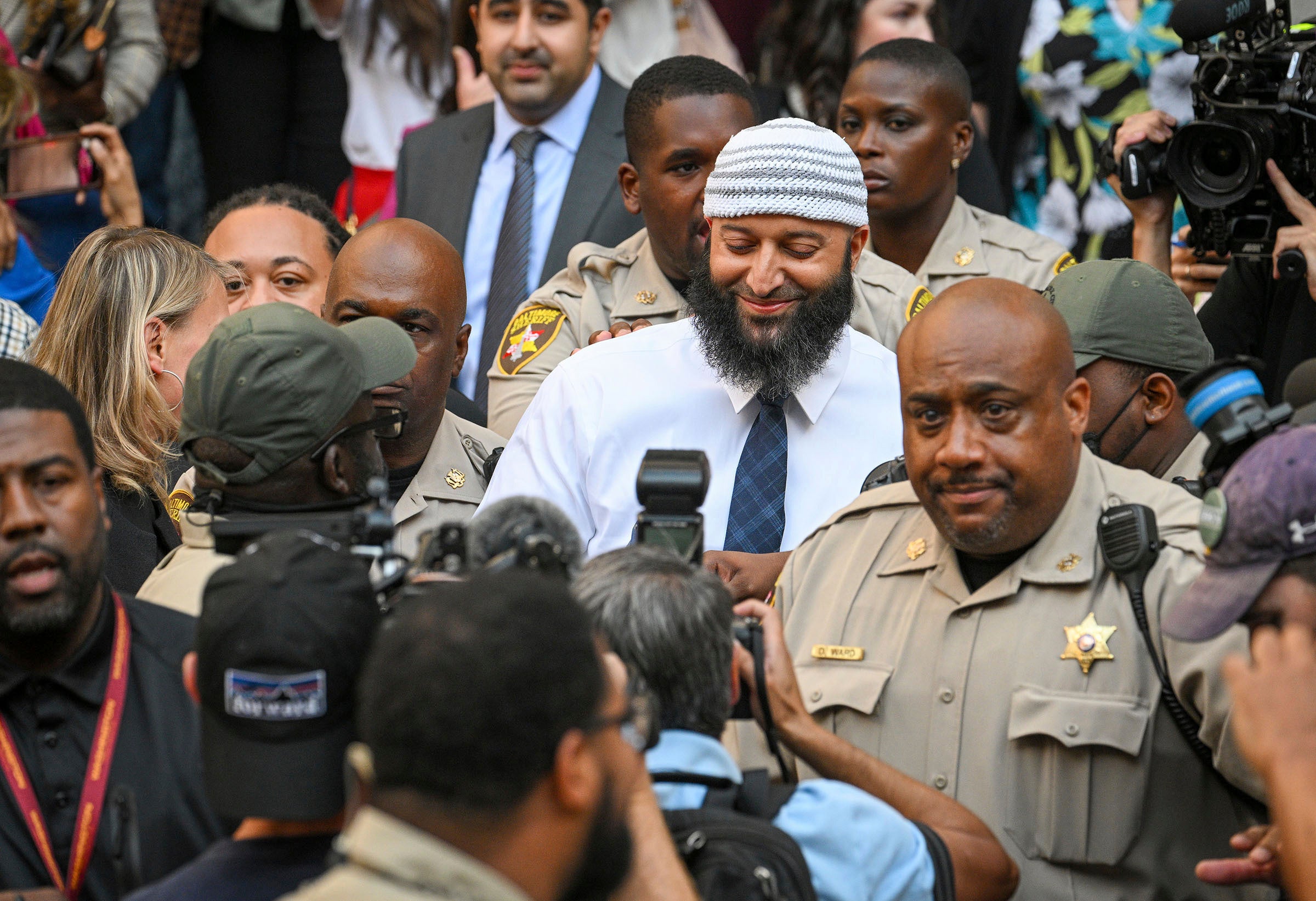 Adnan Syed smiles as he leaves court a free man on Monday
