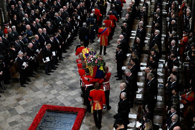 The coffin of the Queen is carried by the bearer party into Westminster Abbey (Gareth Cattermole/PA)
