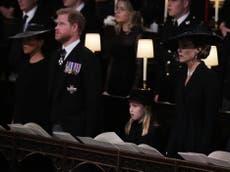 Prince Harry sweetly smiles at Princess Charlotte during Queen Elizabeth II’s funeral