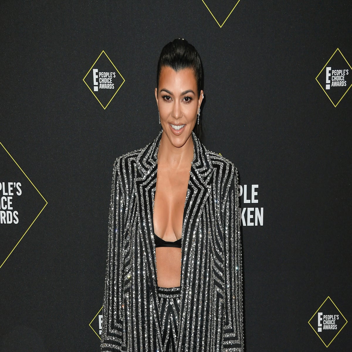 Kourtney Kardashian Shuts Down Pregnancy Rumors in Tight-Fitting Outfit