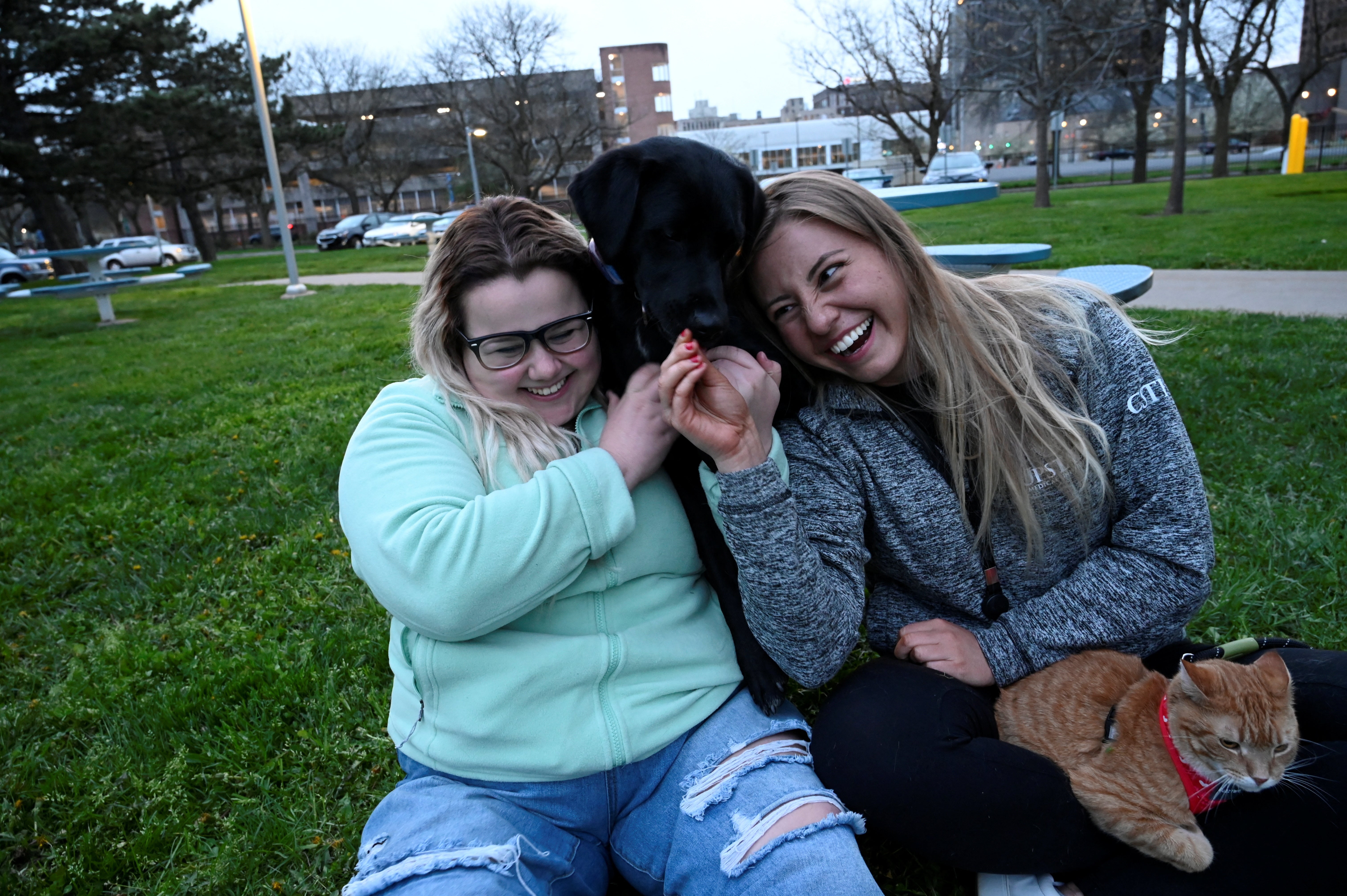 Vika Rauzina joins Nicole, and their respective pets, in their student building’s park