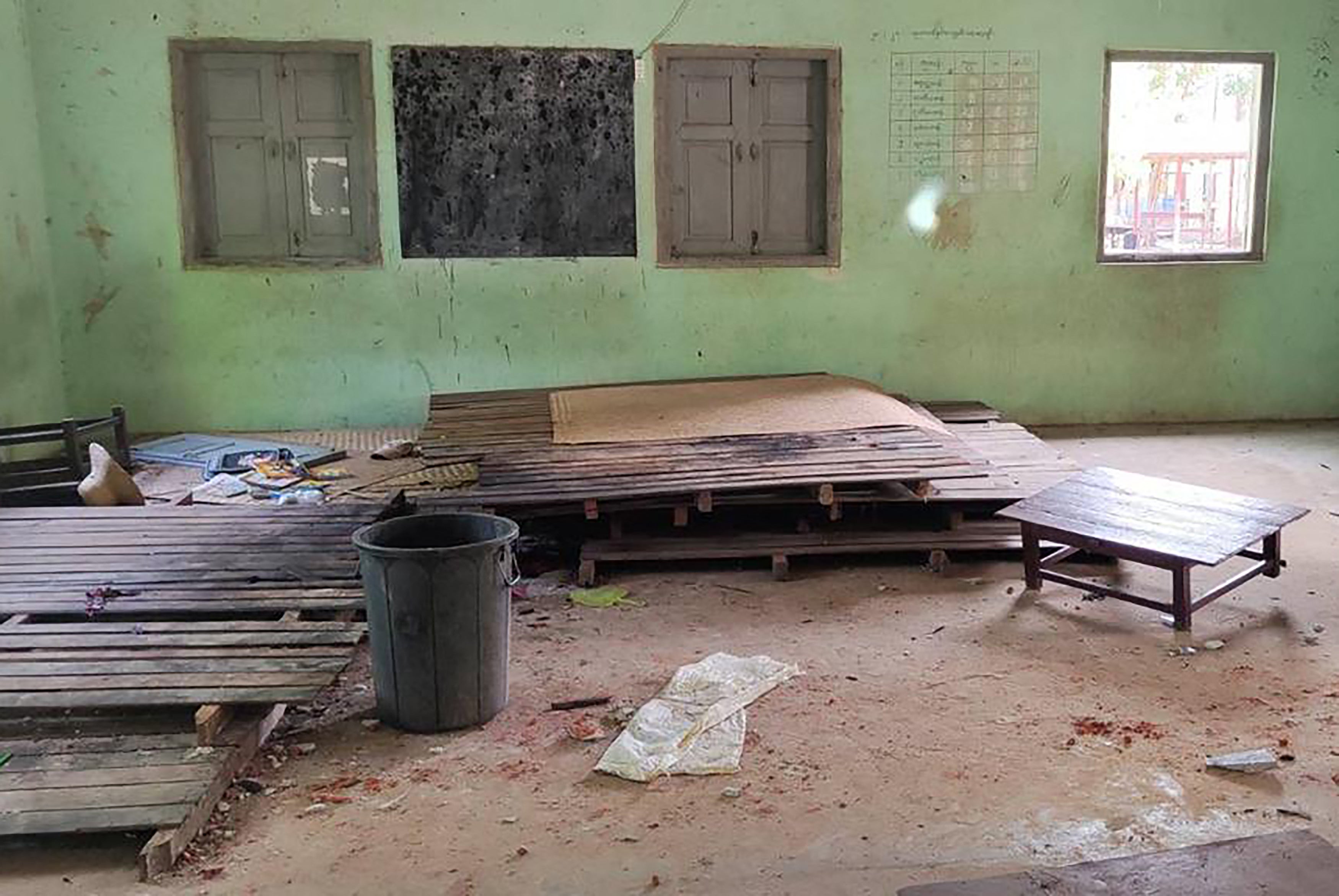 This photo taken on 17 September 2022 shows debris and bloodstains on the floor of a damaged school building in Depeyin township in Myanmar’s northwest Sagaing region, a day after an attack on the village by a Myanmar military helicopter