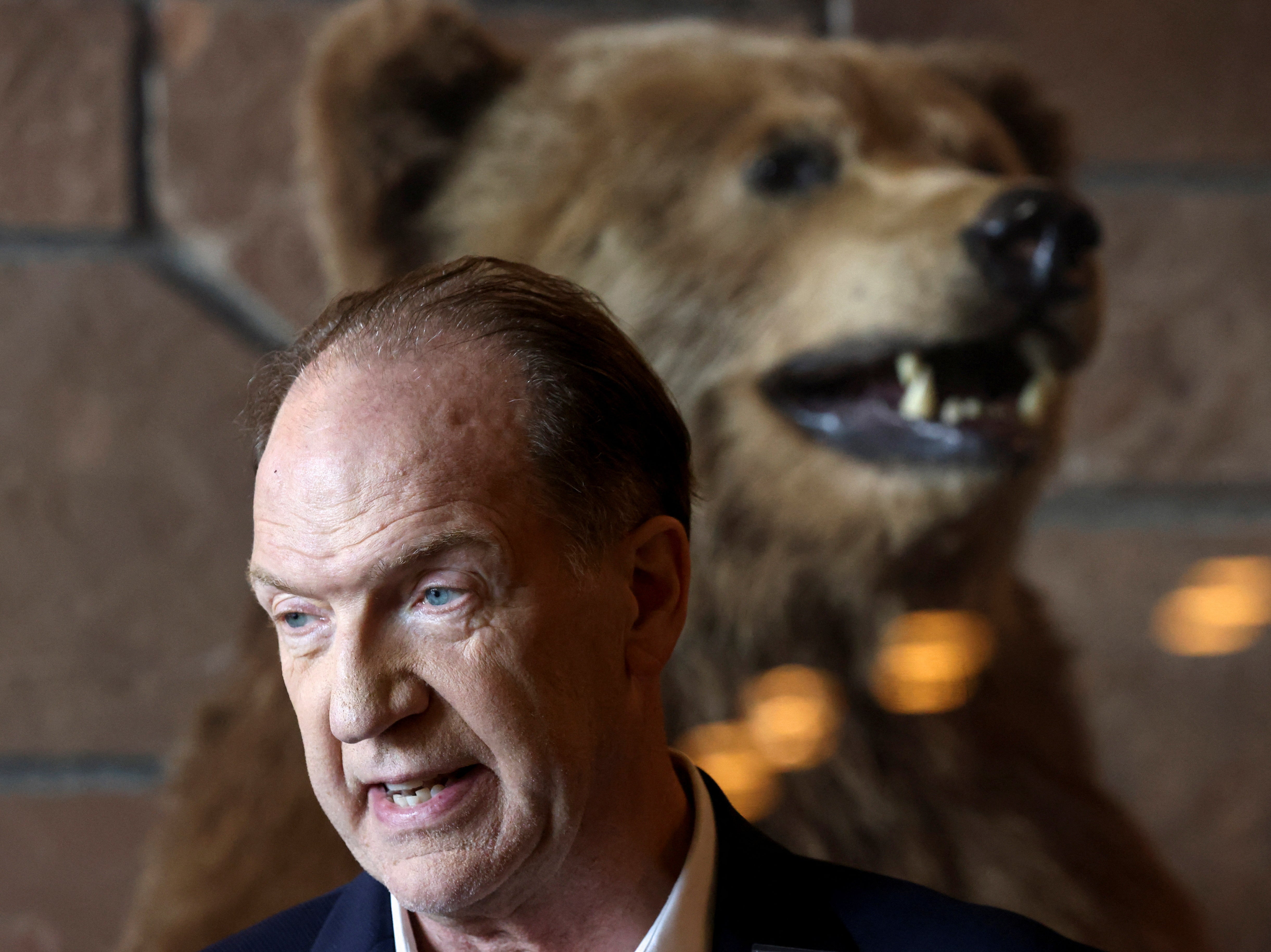 <p>It’s behind you! David Malpass, president of the World Bank Group in front of a stuffed grizzly bear at the Jackson Hole Economic Symposium, in Wyoming</p>