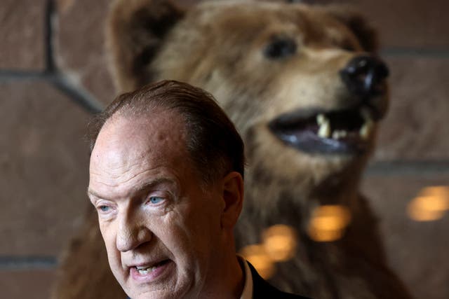 <p>It’s behind you! David Malpass, president of the World Bank Group in front of a stuffed grizzly bear at the Jackson Hole Economic Symposium, in Wyoming</p>