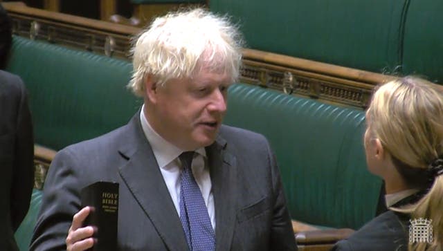 Former prime minister Boris Johnson pledges allegiance to the King (House of Commons/PA)
