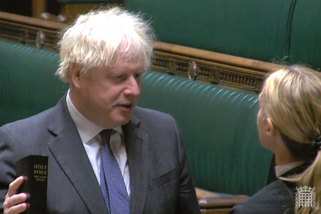 Former prime minister Boris Johnson pledges allegiance to the King (House of Commons/PA)