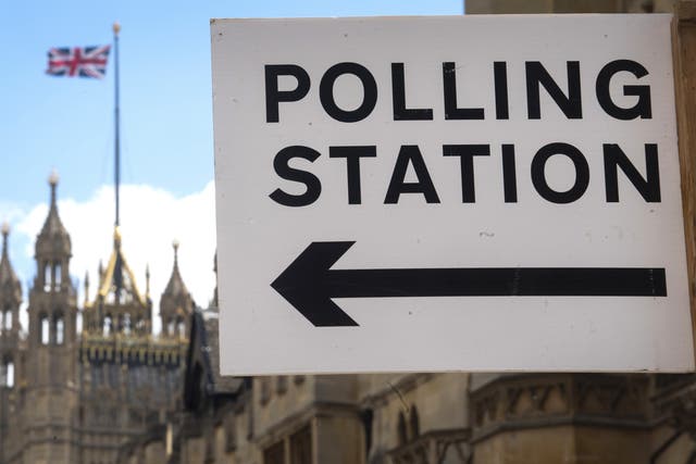 <p>Signage outside a polling station in Westminster</p>