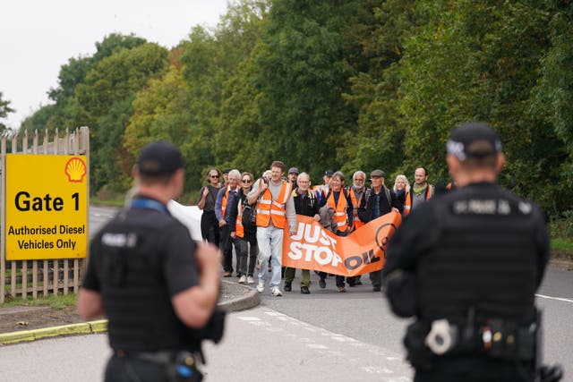 People take part in a Just Stop Oil protest blocking the entrance to the Kingsbury Oil Terminal near Birmingham. Picture date: Wednesday September 14, 2022 (Joe Giddens/PA)