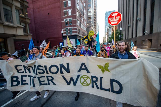 <p>Extinction Rebellion protestors in Boston on Wednesday. Several  activists have been arrested after blocking traffic</p>