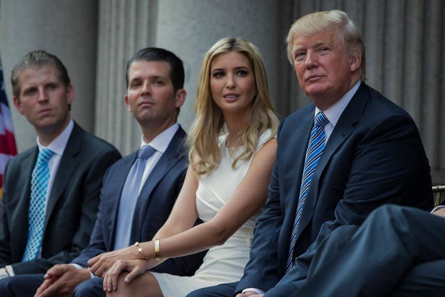 <p>Donald Trump seated with his three eldest children in 2018 </p>