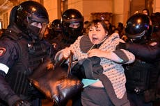 Putin news – live: Russia threatens nuclear retaliation, as protests flare in Moscow