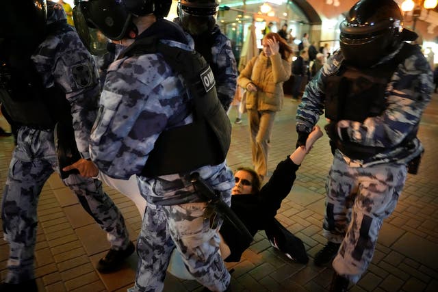 <p>Riot police detain a demonstrator during a protest in Moscow</p>