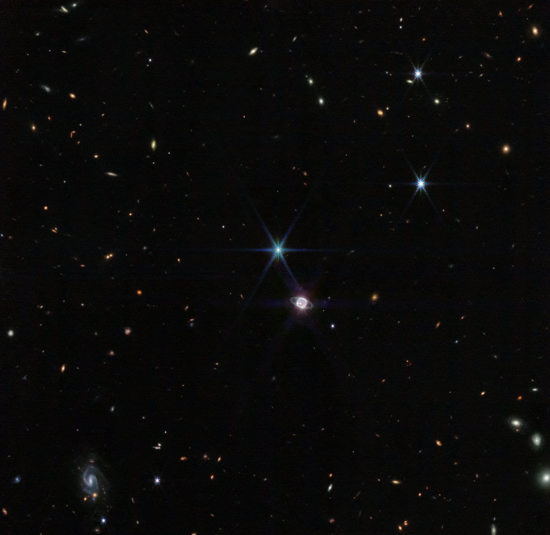 The latest James Webb Space Telescope image shows a glowing Neptune amidst a sea of stars