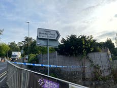 Boy, 16, arrested on suspicion of murder after teen stabbed outside school gates
