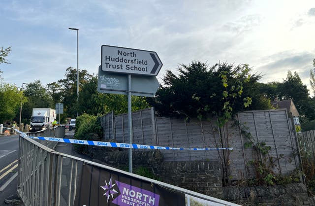 <p>Police cordon near to the scene in Woodhouse Hill, Huddersfield, where a 15-year-old boy was stabbed and later died in hospital on Wednesday.</p>