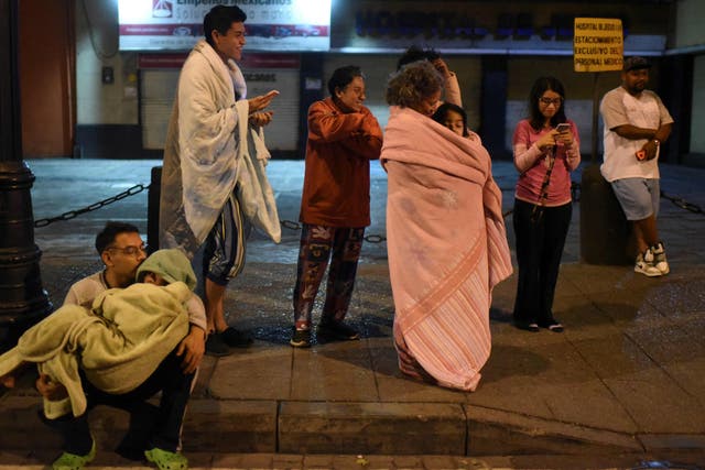 <p>Residents on the street of Mexico following a 6.8 magnitude earthquake</p>
