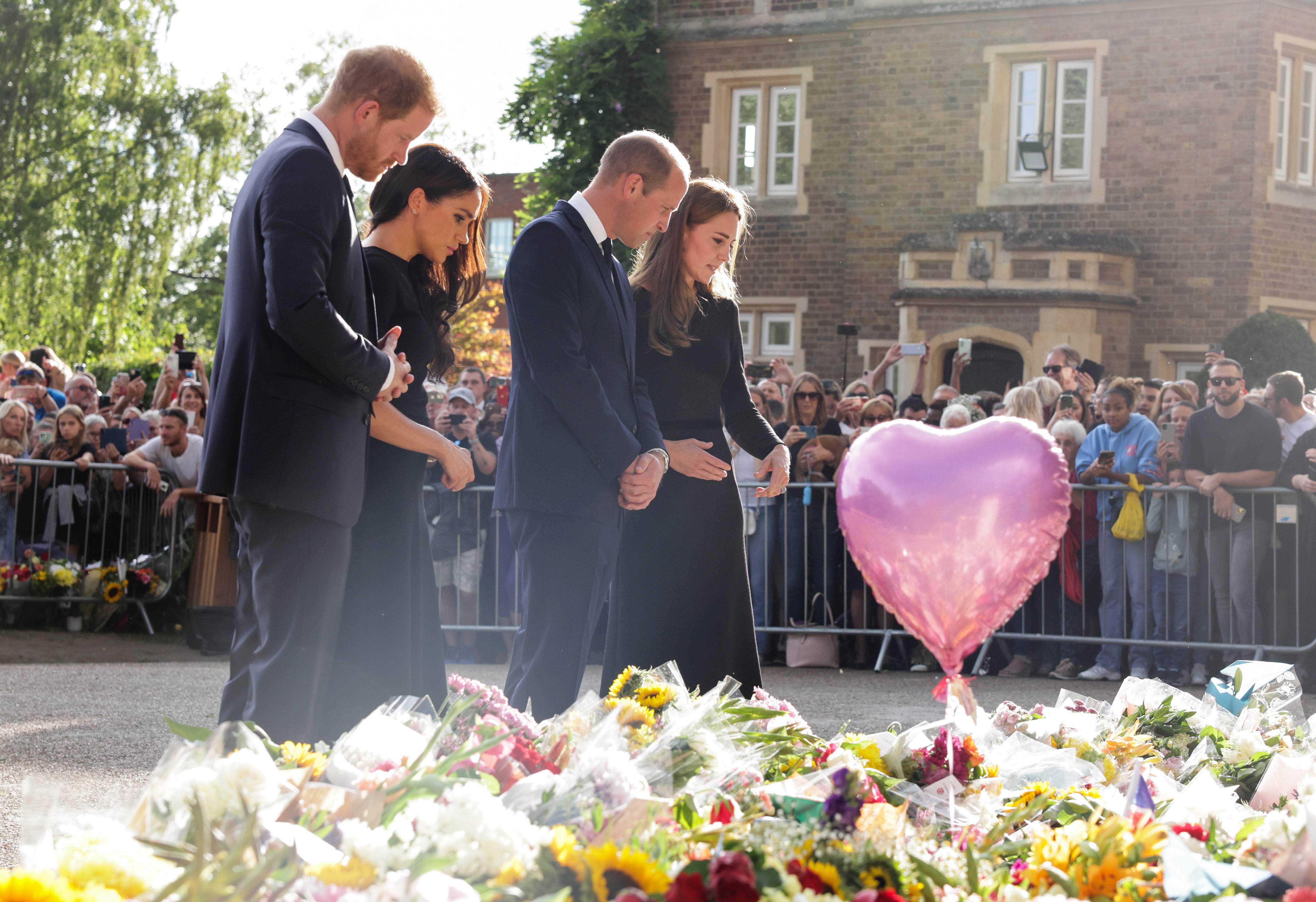 Harry, Meghan, William and Kate view the floral tributes at Windsor Castle (Chris Jackson/PA)
