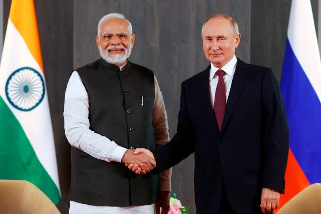 <p>Russian President Vladimir Putin, right, and Indian Prime Minister Narendra Modi pose for a photo shaking hands prior to their talks on the sidelines of the Shanghai Cooperation Organisation</p>