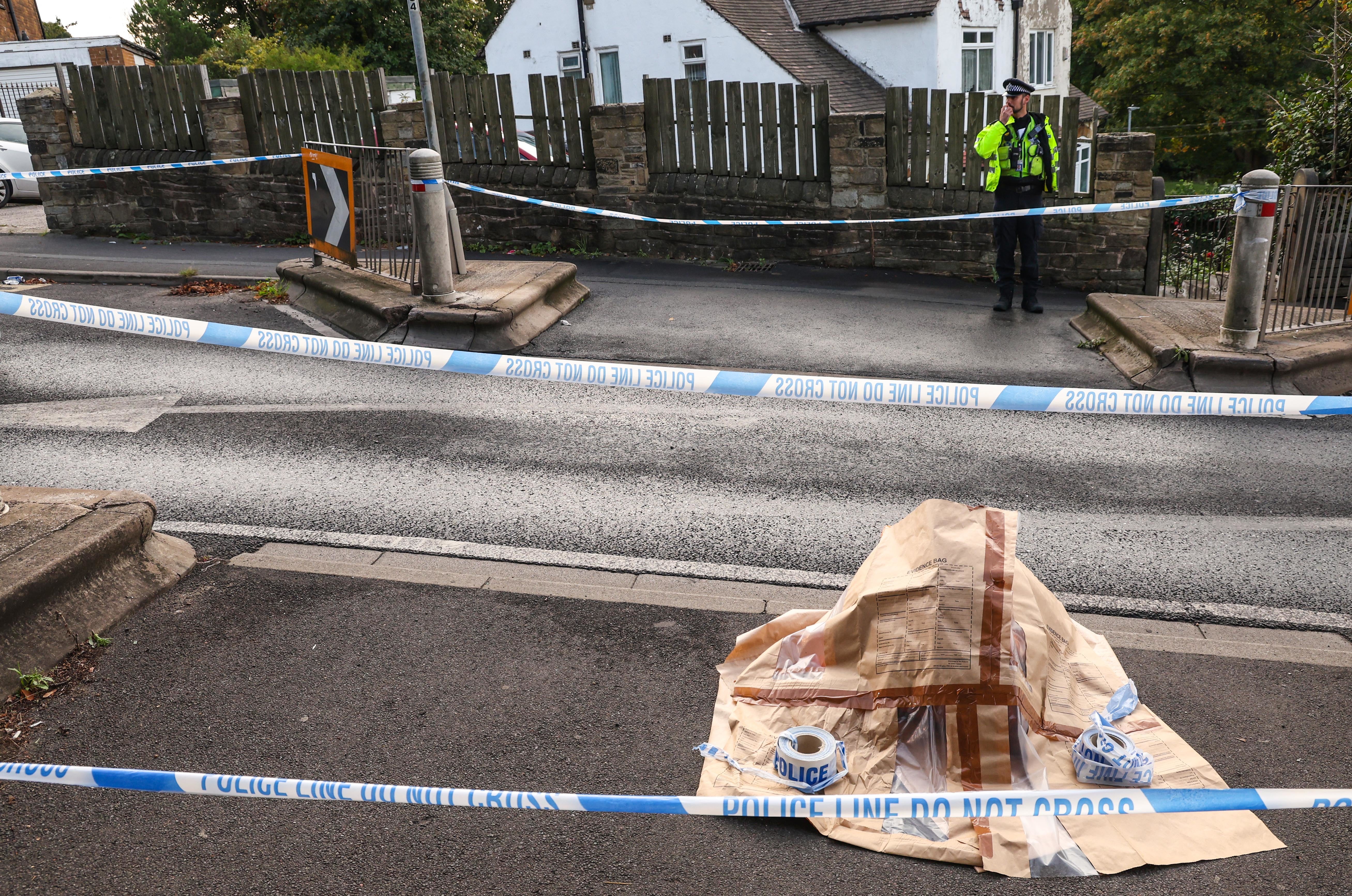A police evidence bag at the scene (Nigel Roddis/PA)
