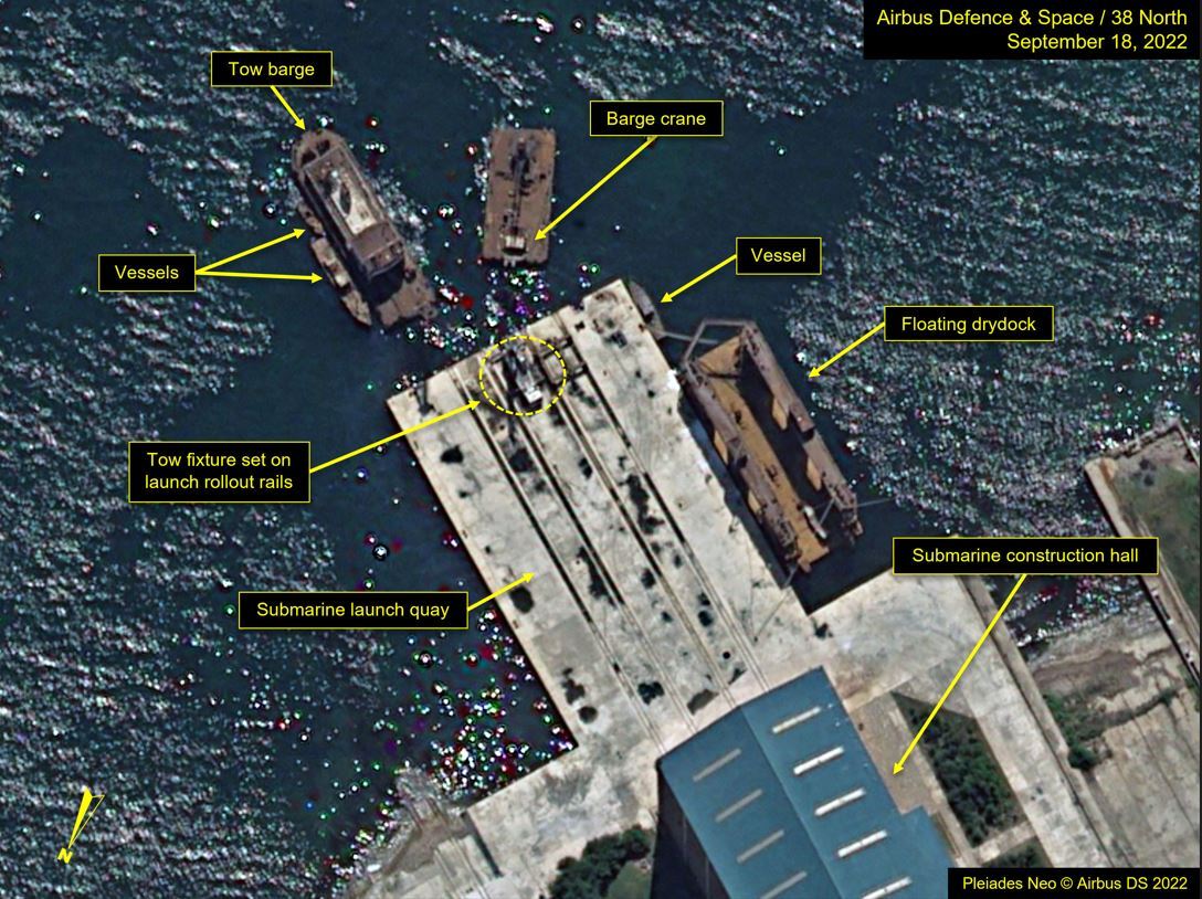 Satellite image shows six barges and vessels gathered around the construction hall quay at the Sinpho South Shipyard in North Korea