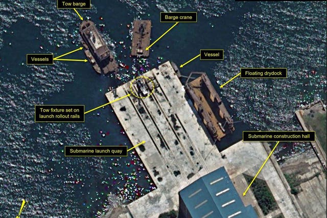 <p>Satellite image shows six barges and vessels gathered around the construction hall quay at the Sinpho South Shipyard in North Korea </p>