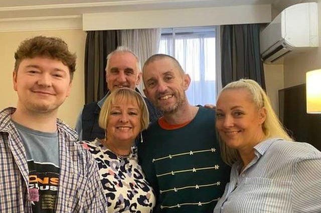 <p>Shaun Pinner (dark top) pictured back in the UK with his family</p>