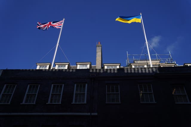 The flag of Ukraine is flown beside the Union flag above Downing Street (Victoria Jones/PA)