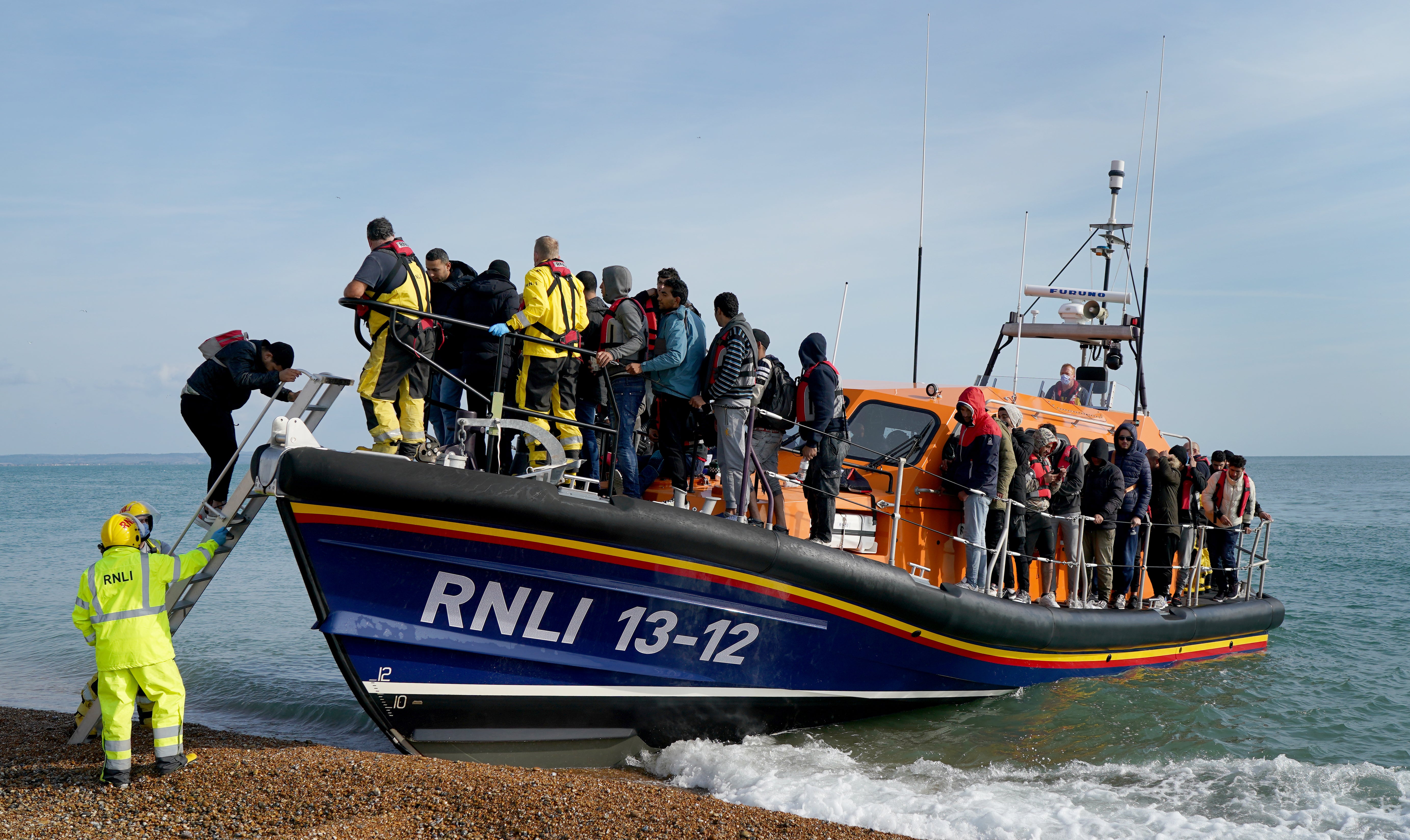 A group of people thought to be migrants arrive in Dungeness, Kent on Thursday September 22 (Gareth Fuller/PA)