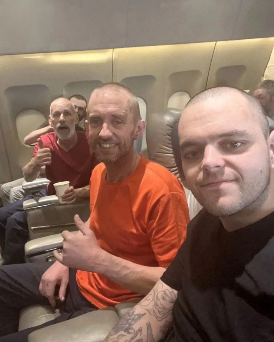 <p>British prisoners of war on their flight home after being freed from Russian captivity while fighting for Ukraine</p>