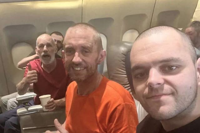 <p>British prisoners of war on their flight home after being freed from Russian captivity while fighting for Ukraine</p>
