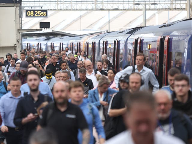 <p>Commuters at Waterloo station </p>