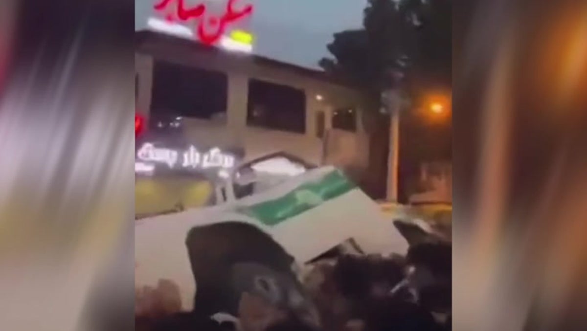 Protesters trash police cars in Iran as demonstrations continue across country