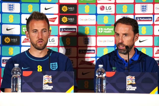 England manager Gareth Southgate, right, and captain Harry Kane spoke about how to address the ongoing issues in Qatar (PA)
