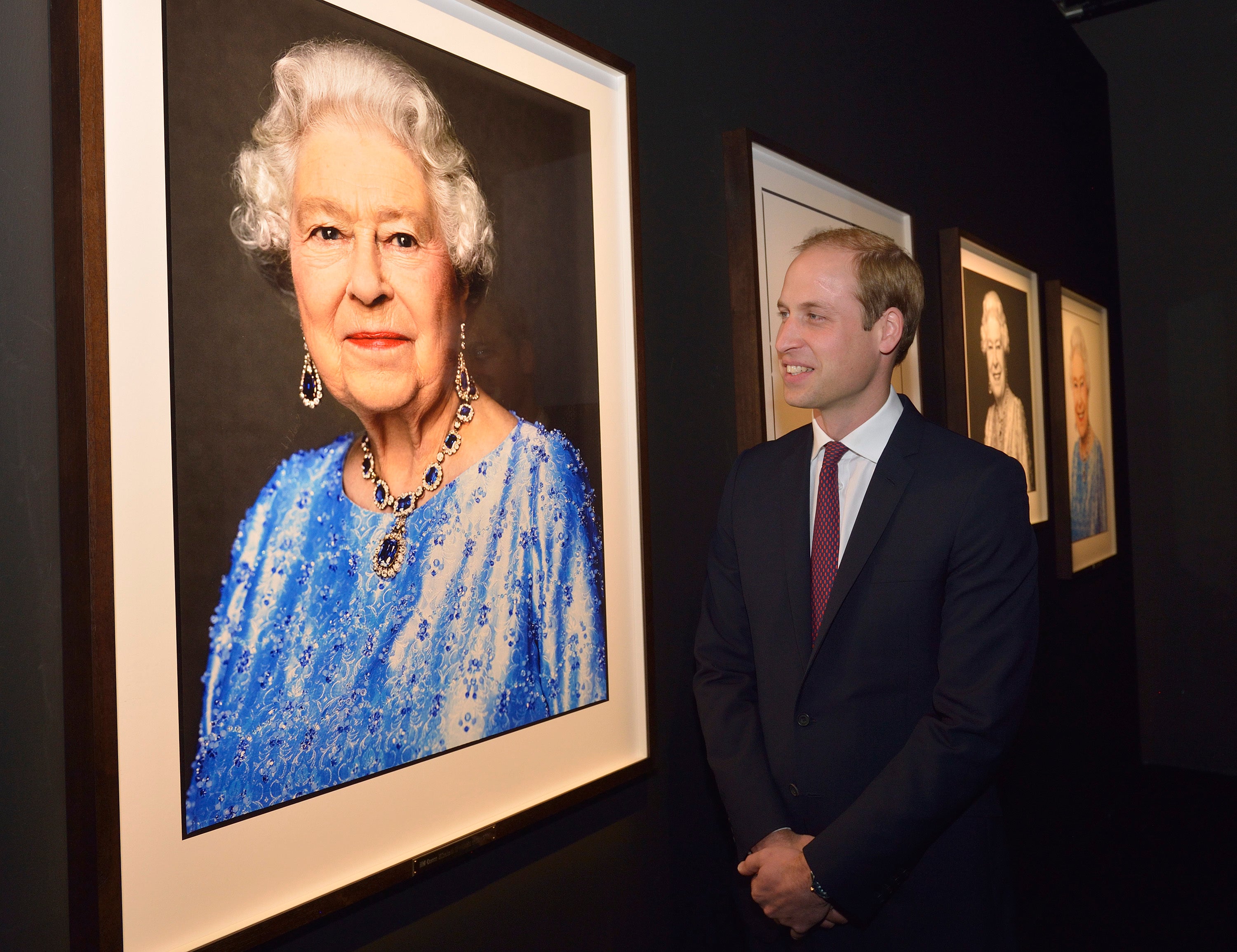 The Duke of Wales looks at David Bailey’s portrait of his grandmother (Arthur Edwards/The Sun/PA)