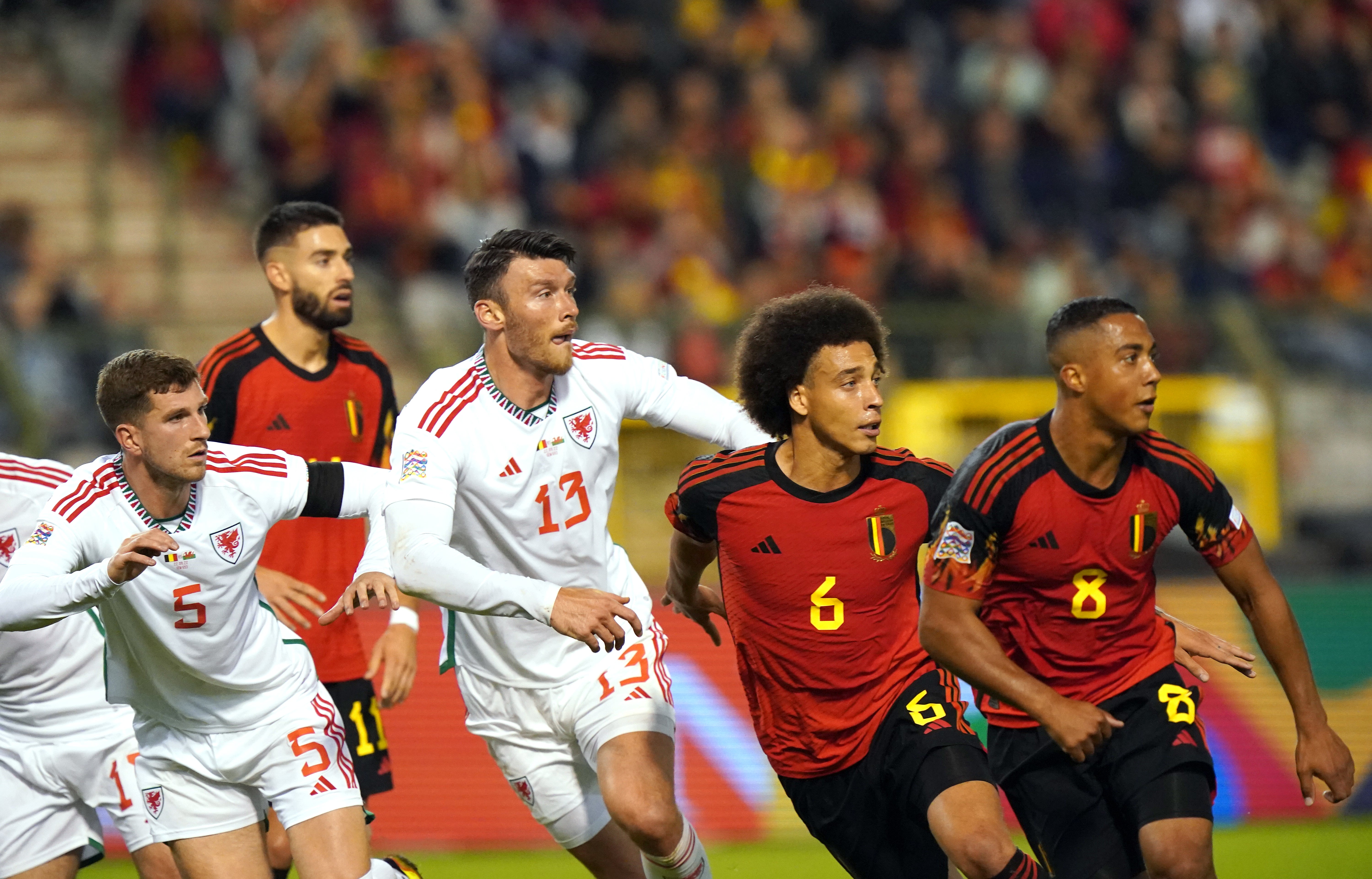 Wales’ Kieffer Moore and Belgium’s Axel Witsel wait for a free-kick to come in (Tim Goode/PA)