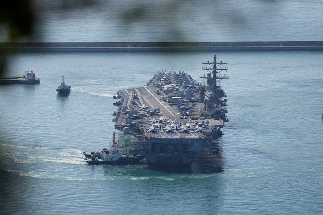 <p>US aircraft carrier USS Ronald Reagan is escorted into Busan Naval Base in Busan, South Korea </p>