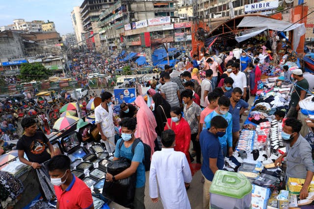 <p>Representative image: People shop at a market ahead of Eid-al Adha in Dhaka, Bangladesh, 16 July 2021</p>