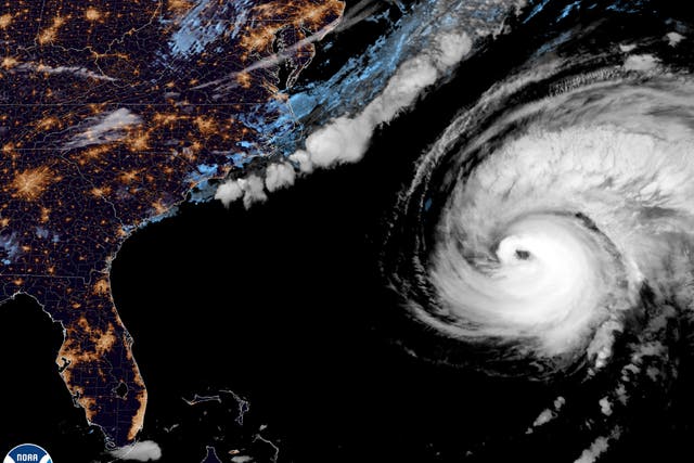 <p>A National Hurricane Center satellite view as Hurricane Fiona moves up the United States Atlantic coast on Sept. 22, 2022. Hurricane Fiona is on a path that has it reaching northeastern Canada as a still-powerful storm late Friday (NOAA via AP)</p>