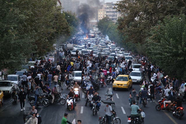 <p>Iranian demonstrators take to the streets of the capital Tehran</p>