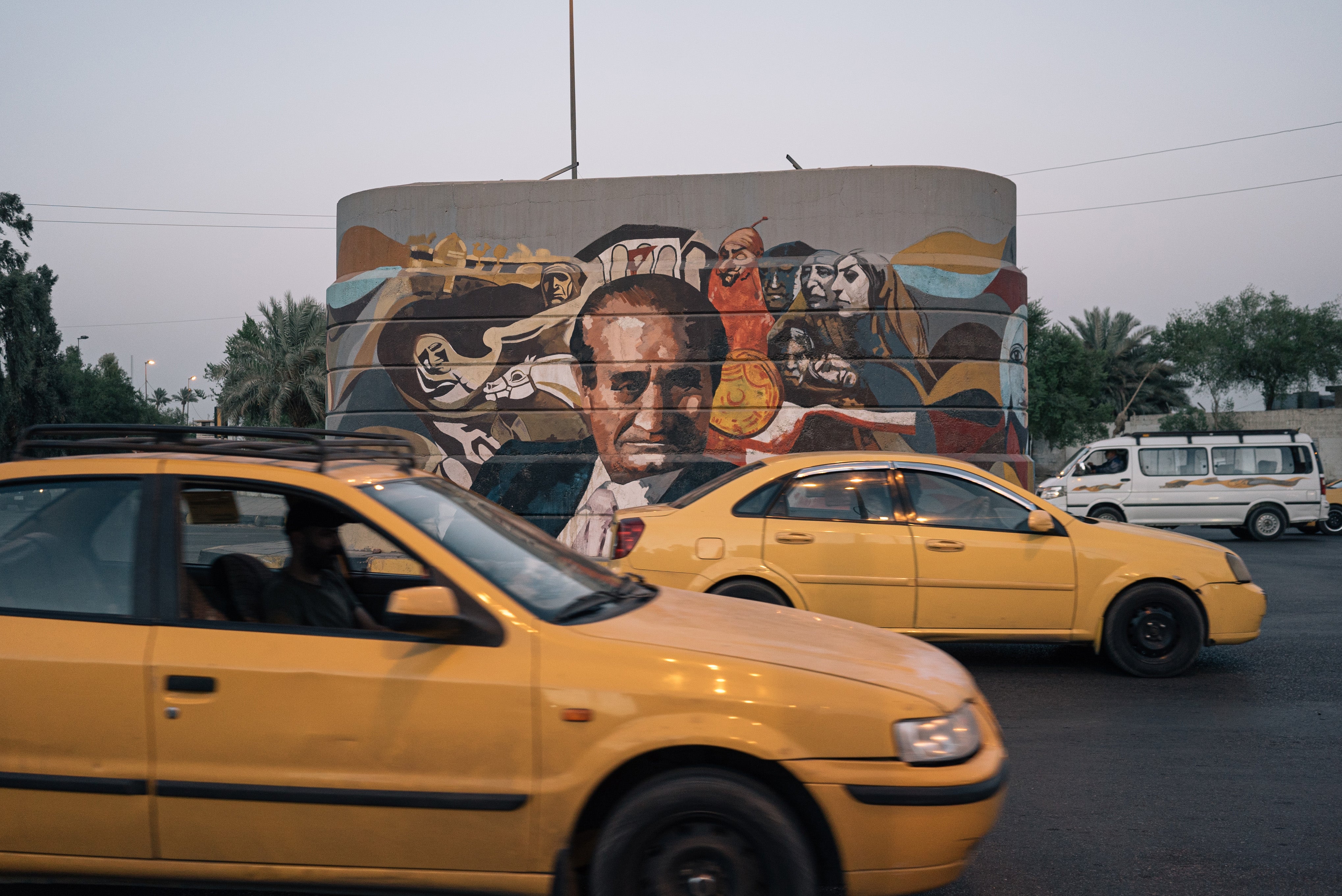 A mural in Baghdad depicts the late Iraqi artist Mahood Ahmed, one of several painted by Wijdan al-Majed