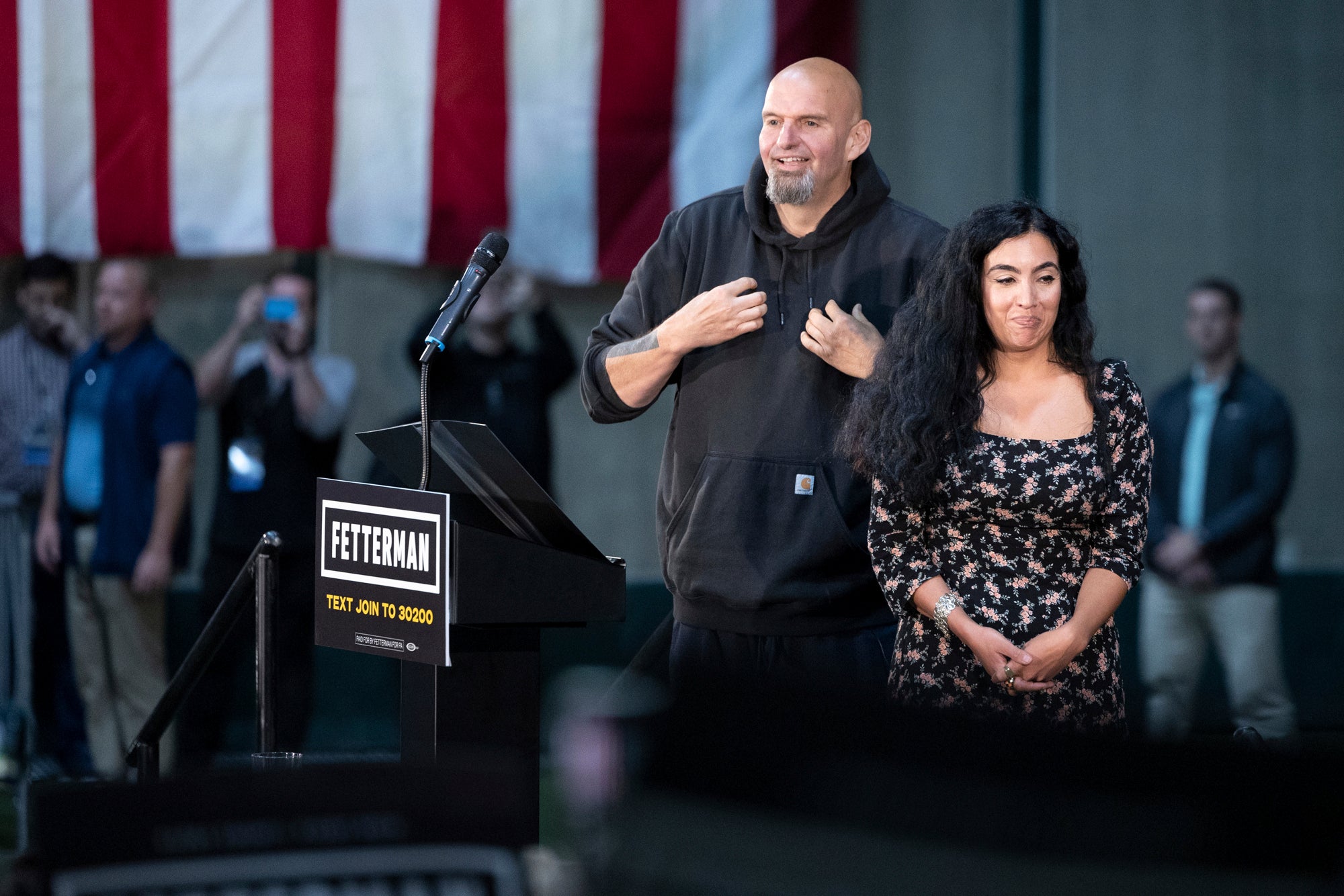 Pennsylvania Lt. Gov. and Democratic candidate for U.S. Senate John Fetterman takes the stage with his wife, Gisele, during a rally at Riverfront Sports in Scranton, Pa., on Saturday, Sept. 17, 2022.