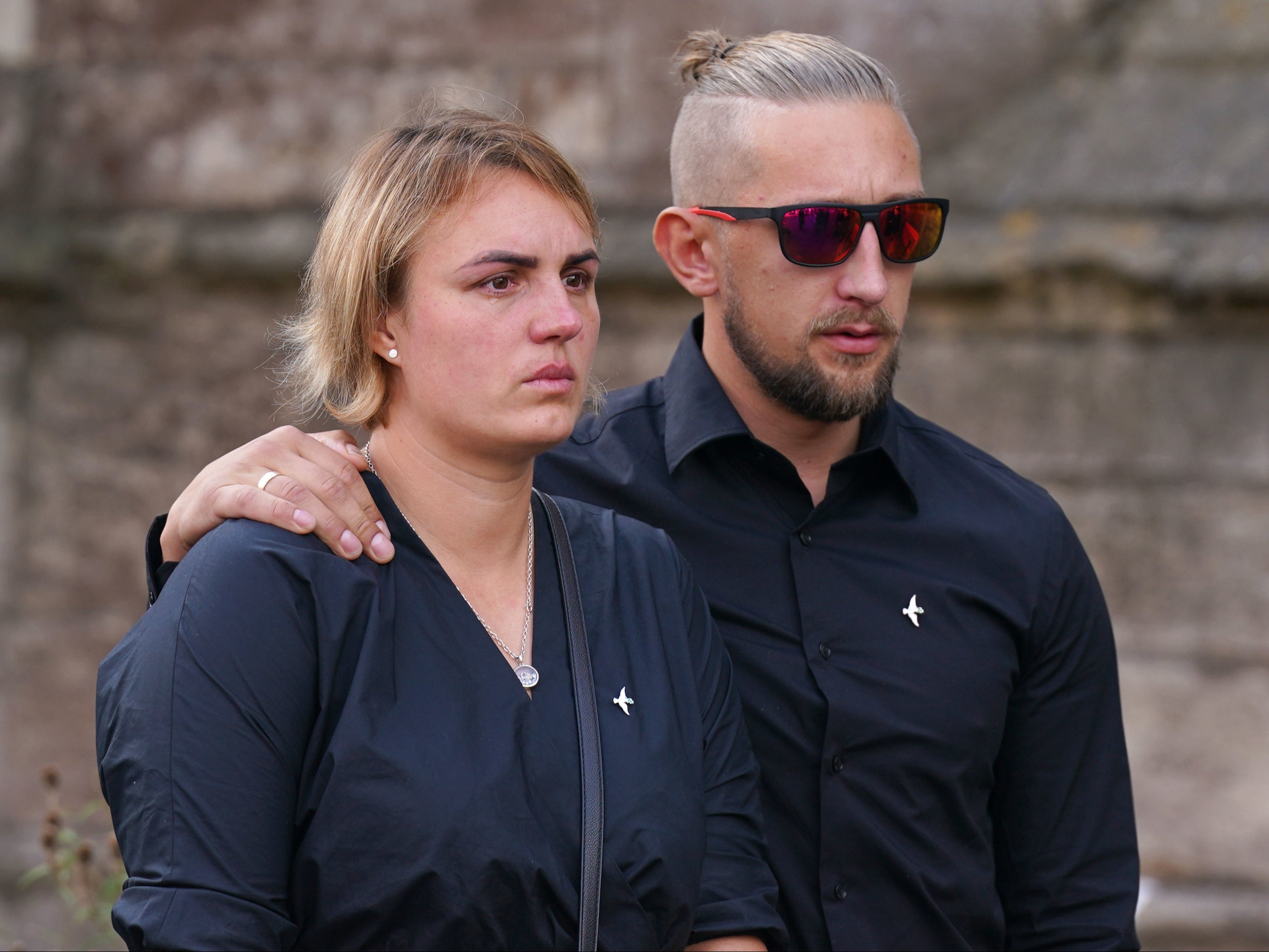 Lilia’s mother Lina Savicke and step-father Aurelijus Savickas at her funeral